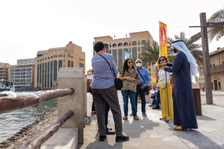 Tourist's Enjoying Dubai Abra Creak Side Walking Tour